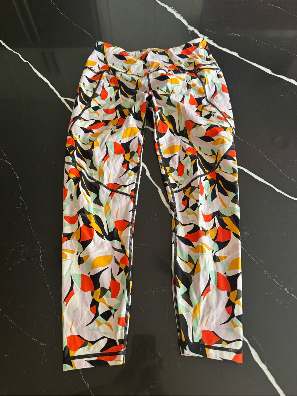 Sweaty Betty multicolor abstract print leggings in mint, red, yellow and black